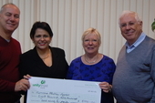 CSC director Rob Miller with executive members Carol and Bernard Regan delivering a cheque to Cuban ambassador HE Teresita Vicente